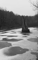 Frozen lake with stone structure