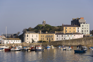 UK, Wales, Pembrokeshire, Tenby, colourful buildings around the harbour in autumn sunshine