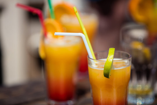 Alcohol orange daiquiri cocktail on beach bar