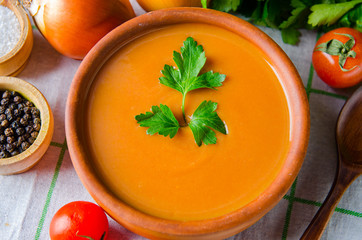 Pumpkin soup served on the table in bowl