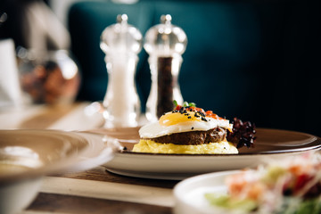 Dinner. Chef's specialty presented in restaurant on served table. Clouse up. Rustic style