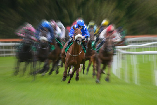 Lead racehorse and jockey zoom motion blur background