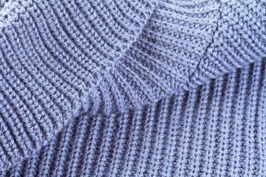 Sweater fabric texture. Part of knitted wool.