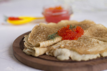 tasty red caviar is a real imitation of iodine with a festive meal pancakes Mardi Gras celebration