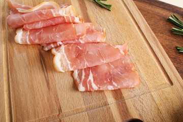 bacon sliced on a wooden background