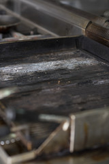 Close up of grill in a kitchen restaurant; no fire, no food