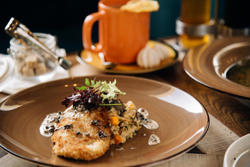 Dinner. Chef's specialty presented in restaurant on served table. Clouse up. Rustic style