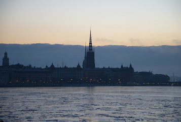 Fototapeta premium Landmarks an houses at the island Riddarholmen and old town at the lake Malaren in Stockhlom