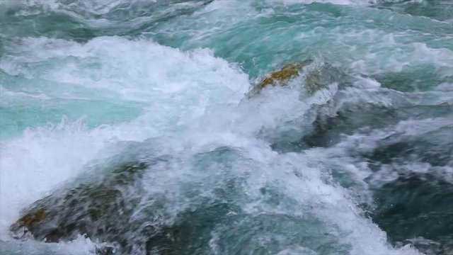 Mountain river water with slow motion closeup