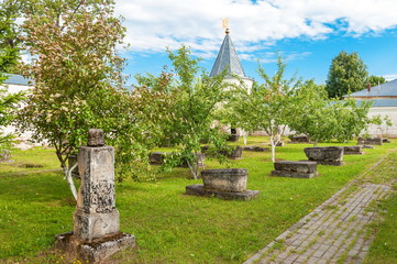 Fototapeta premium Ruins of ancient tombstones in the old cemetery