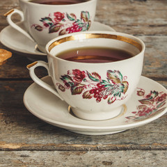 tea-drinking with cookies - on a wooden table