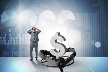Businessman being trapped by dollar
