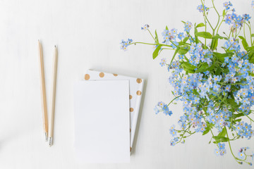 Flat lay desk with blue flowers