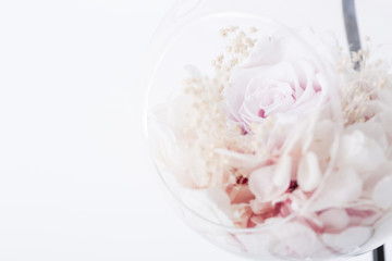 Dried Flowers. Dried pink roses heads and petals in glass.