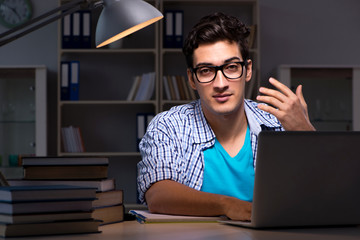 Student preparing for exams late night at home