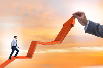 Businessman supporting growtn in economy on chart graph