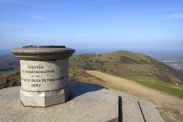 Naklejka premium The toposcope and memorial on Worcestershire Beacon in hazy spring sunshine, the highest point on the Malvern Hills , Worcestershire, UK