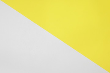 Two color paper with Yellow and white Overlap on the floor And split half of the image. background