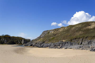 Looking back on Broad Haven South beach towards Bosherston Lily Ponds spring sunshine, Pembrokeshire, Wales, UK