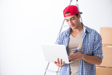 Young painter contractor choosing colors for home renovation