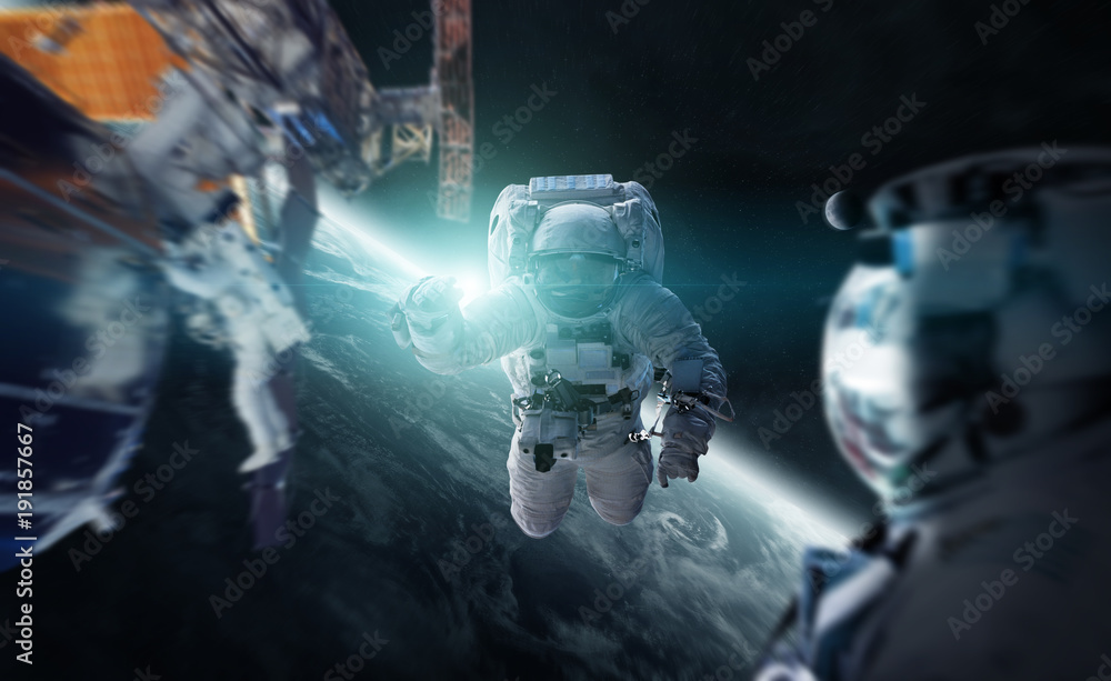 Poster astronaut working on a space station 3d rendering elements of this image furnished by nasa