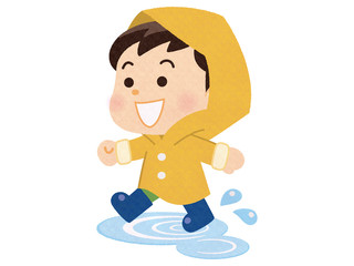 Obraz na płótnie Canvas 雨具を来て水たまりを歩く男の子