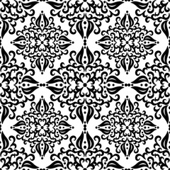 Lace, curls lines. Seamless pattern for fabrics and wallpaper. Black on white background. Vector illustration.
