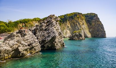 Rocky cliffs in Balkans with people jumping