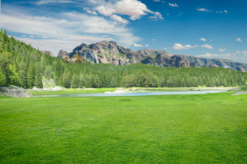 Naklejka premium Amazing nature, green meadow,lake and mountains