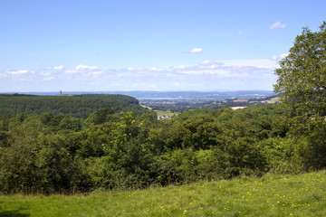 Fototapeta premium View towards the Tynedale Monument on the edge of the Cotswold Hills escarpment near Wotton Under Edge, Gloucesteshire, UK.