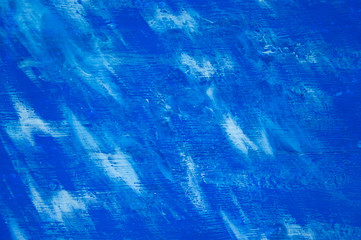 Blue sky with white wispy clouds painted on wood panel background