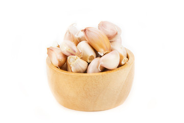 Fototapeta na wymiar Garlic clove in wood bowl isolated white background