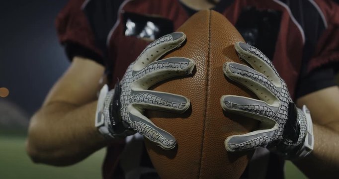 American Football Player Throwing Ball