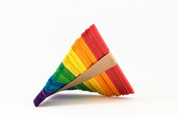 The colorful handicraft wood sticks on white background