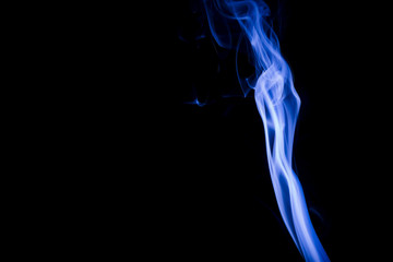 Blue smoke on black background