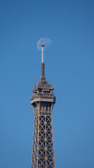 The moon hung on the tower