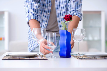 Man alone preparing for romantic date with his sweetheart