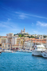 Summer view on basilica of Notre Dame de la Garde and old port in Marseille, France