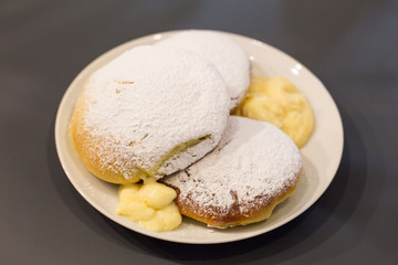 Baked bomboloni with pastry cream