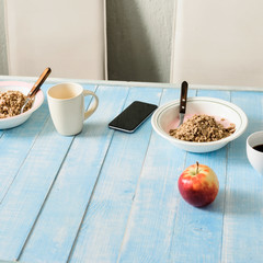 Plates porridge with yogurt, coffee and apple. Healthy breakfast concept