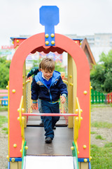 Funny children play on a children's playground