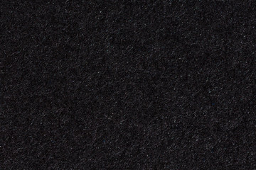 Black paper texture or background.