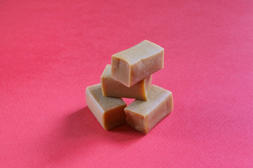 Caramel fudge on colorful background