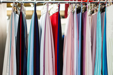 Closeup of colorful scarves hanging in the market.