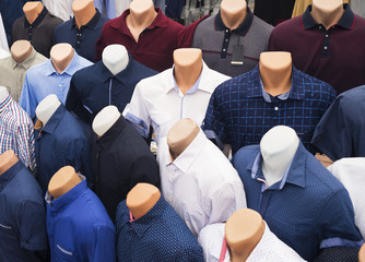 The range of men's shirts on mannequins in the market (selective focus)
