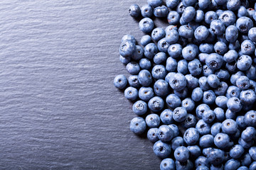 fresh blueberries on dark table