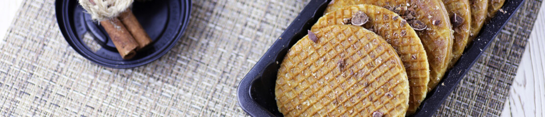 Horizontal panorama bakground of viennese wafers with caramel