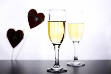 glass of white wine on a table on white background isolate