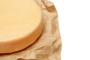 Whole round Head of parmesan or parmigiano hard cheese on white background
