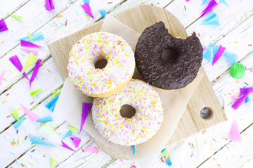 Donut on a wooden white background